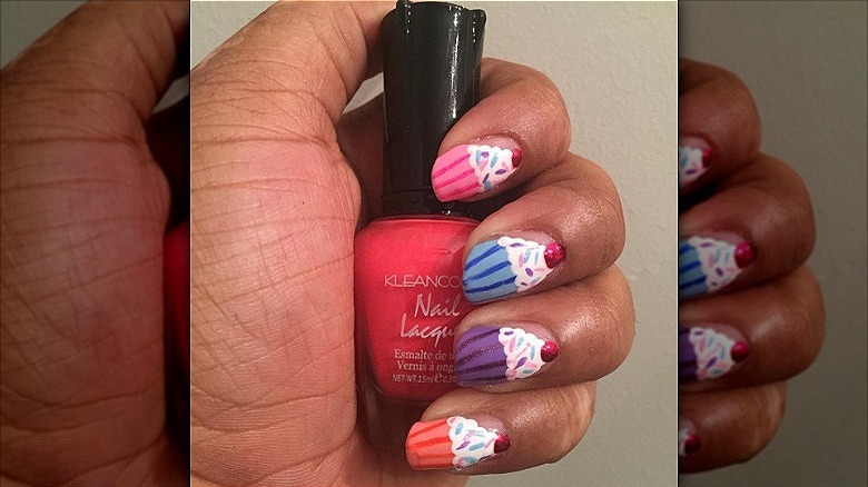 hand with cupcake mismatched nails