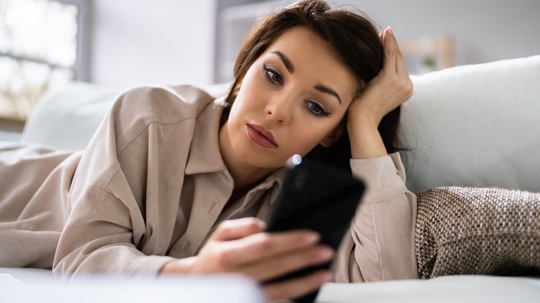 annoyed woman texting