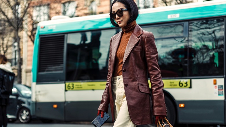 Yoyo Cao wearing turtleneck and leather coat