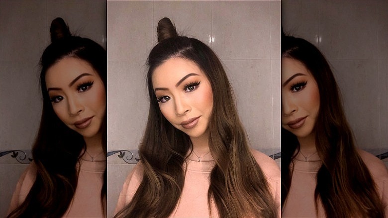 woman with hair in half bun