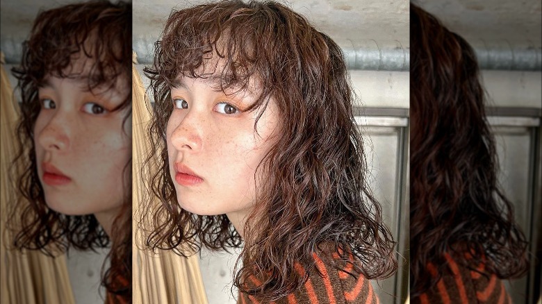 A woman with a permed hair