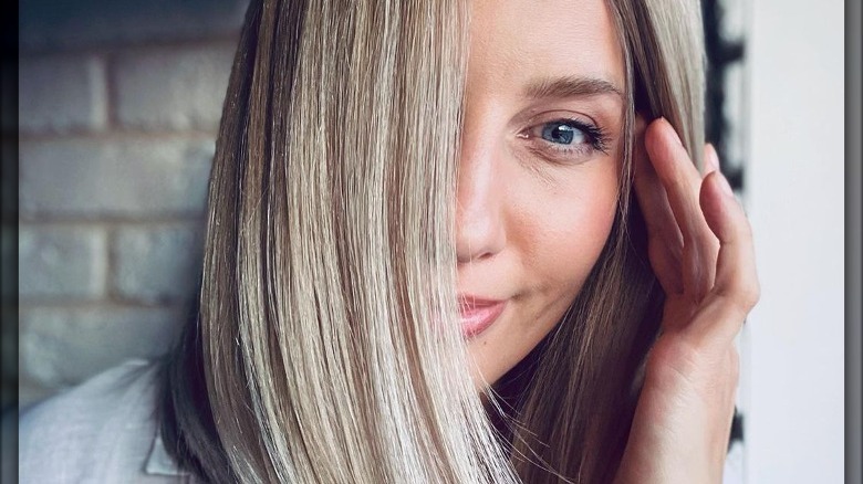 A woman with a sleek lob