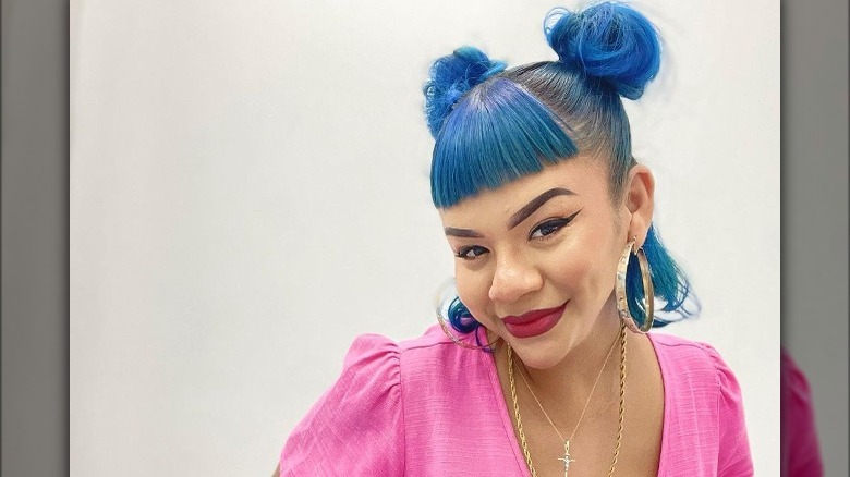 A woman with space buns