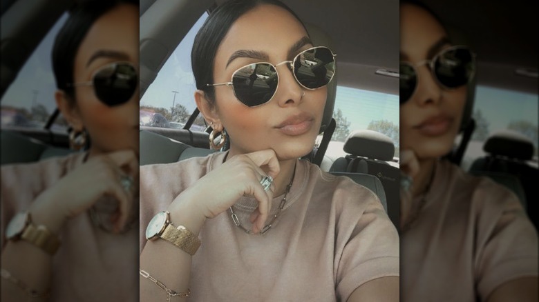 Woman wearing hexagon sunglasses