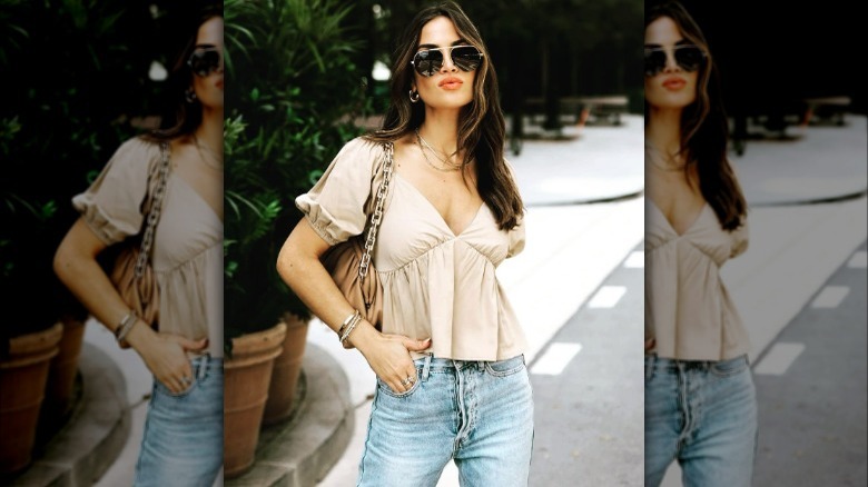 Woman poses in peplum top