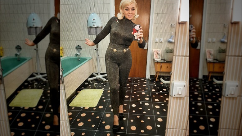 Woman poses in stirrup pants