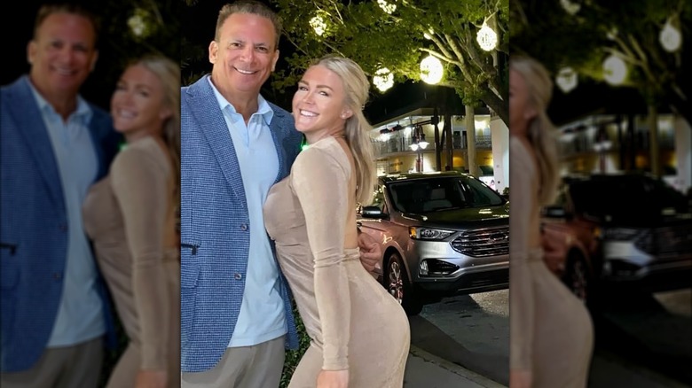 Karoline Leavitt leaning into Nicolas Riccio for a photo