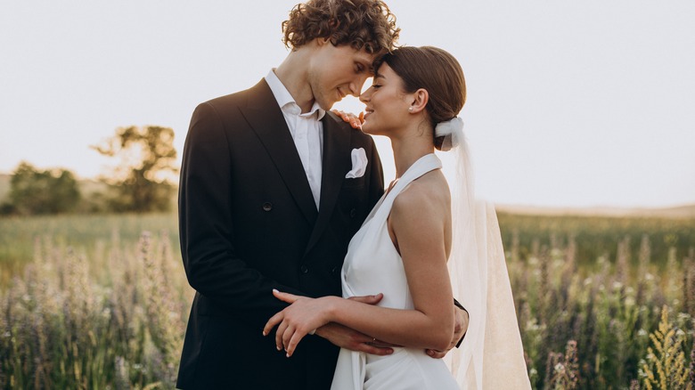 Bride and groom foreheads touching