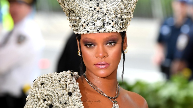 Rihanna wearing a heavily embellished look at the 2018 Met Gala.