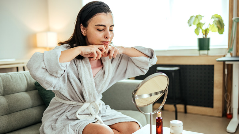 A woman massaging her face