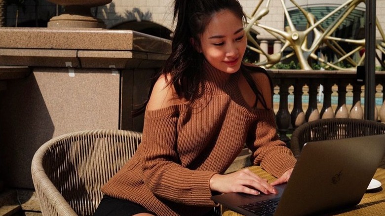 woman wear cold shoulder sweater