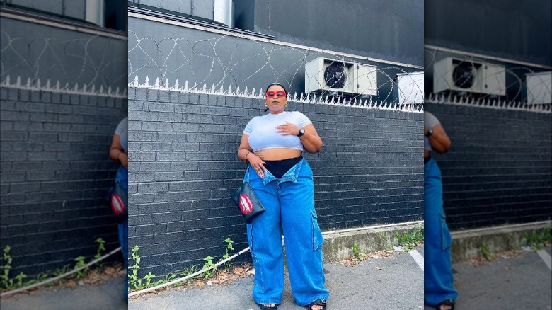 Girl wearing open cargo pants.