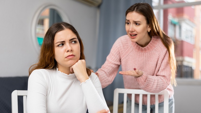 upset woman approaching friend