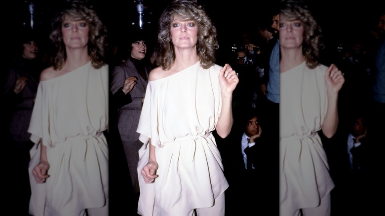 Farrah Fawcett wears an off-the-shoulder top and pants to Studio 54