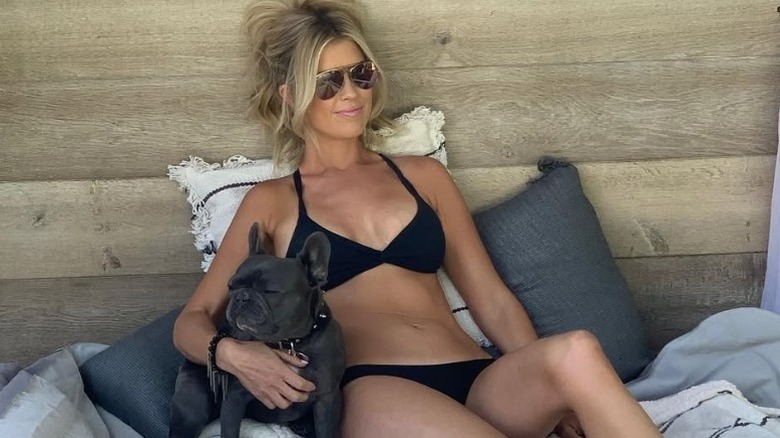 Christina Haack lounges in a black bikini