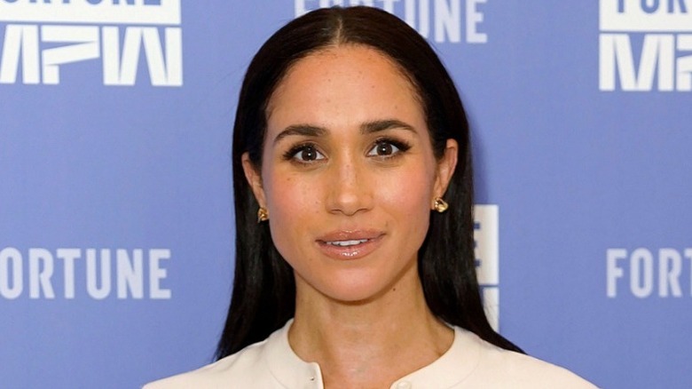 Meghan Markle poses at an event in Washington, D.C.