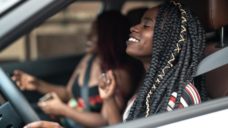 Two friends singing in car