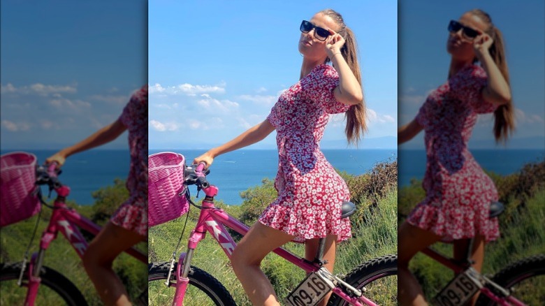 girl posing on a bike