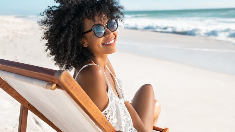Woman smiling at the beach