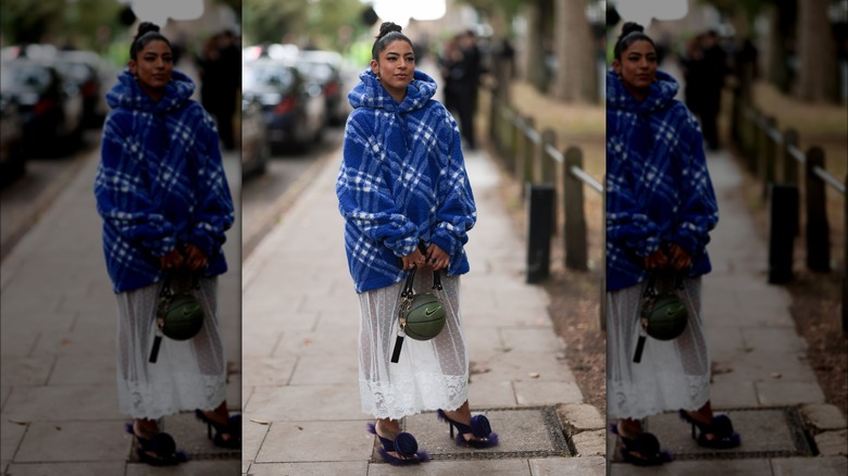Woman wearing hoodie over dress