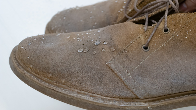Water drops on suede shoes