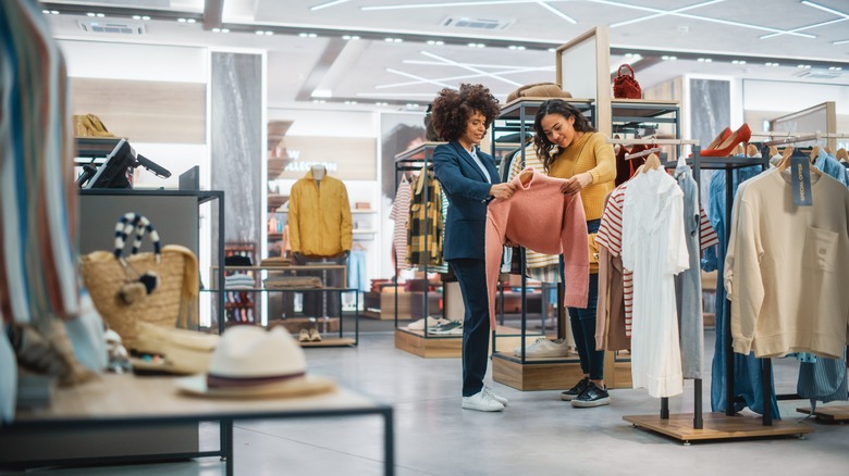woman browsing in clothes store 