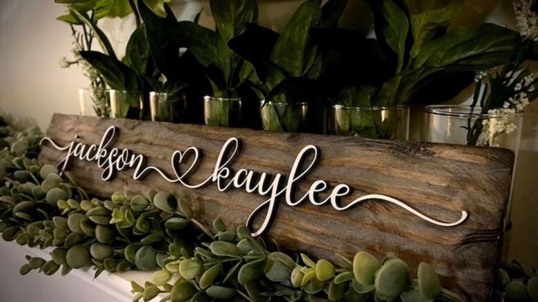 couple names on wood sign