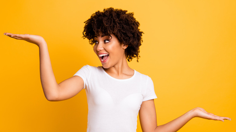 excited woman balancing act hands