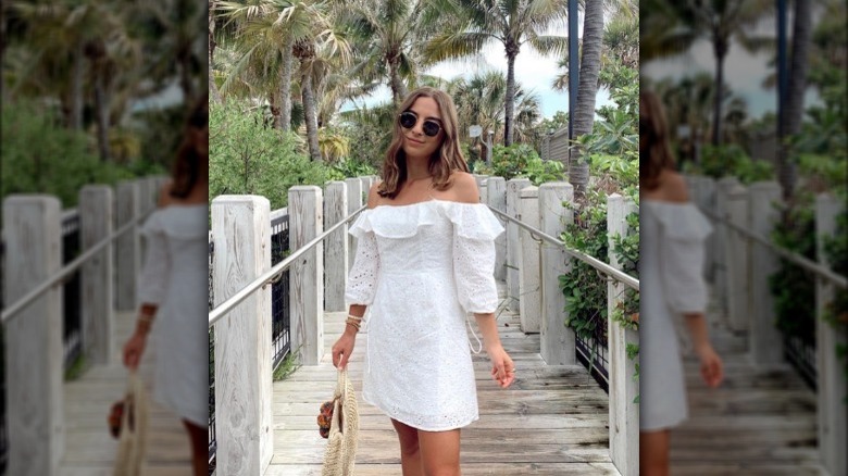 Woman in white eyelet dress