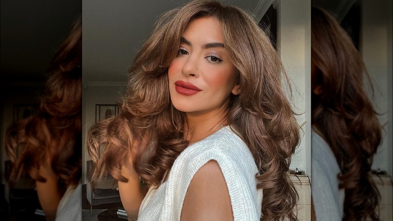 A woman with caramel macchiato hair