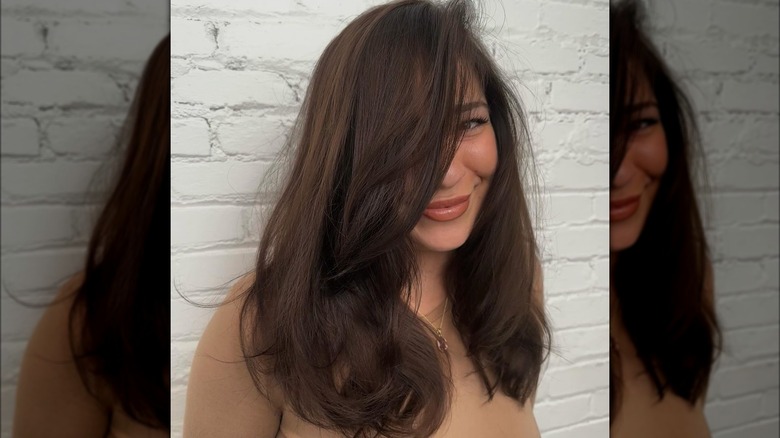 A woman with expensive brown hair