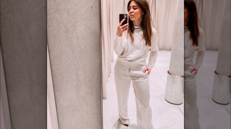 Woman in white outfit selfie