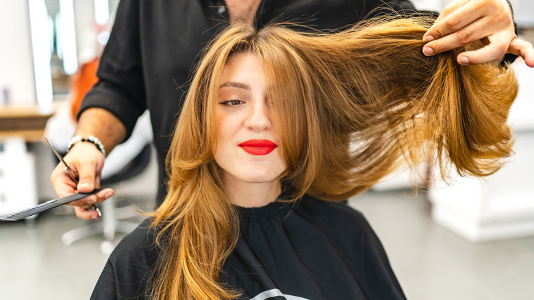 Woman with red hair long layers