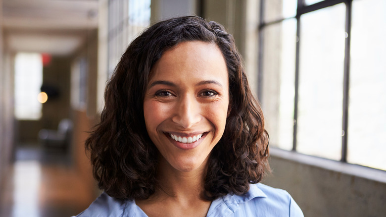 Woman with curly hair smiling