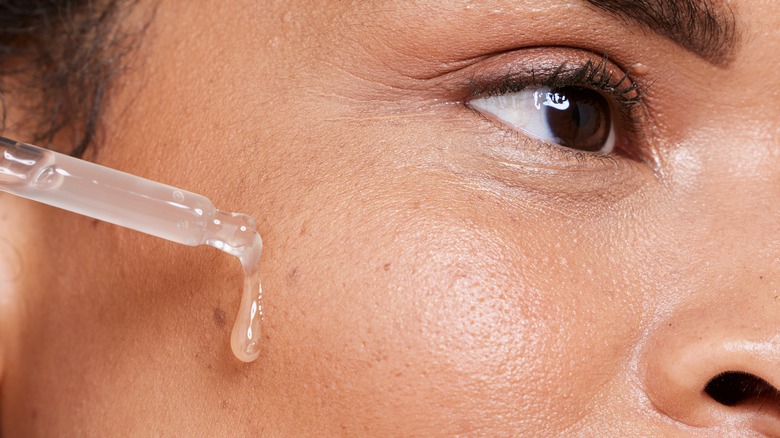 applying silicone oil on face