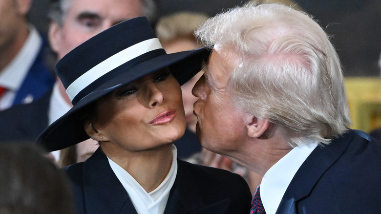 U.S. President-elect Donald Trump kisses Melania Trump at his inauguration in the U.S. Capitol Rotunda on January 20, 2025 in Washington, DC (2025)