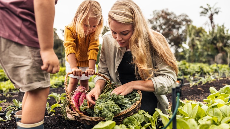 Mother gardening with kids