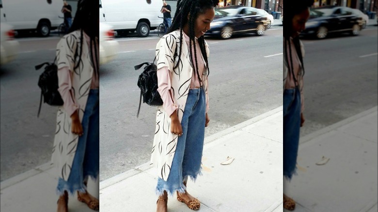 Woman wearing frayed jeans