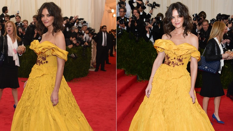 Katie Holmes wears a big yellow dress while posing for photos at the 2014 Met Gala