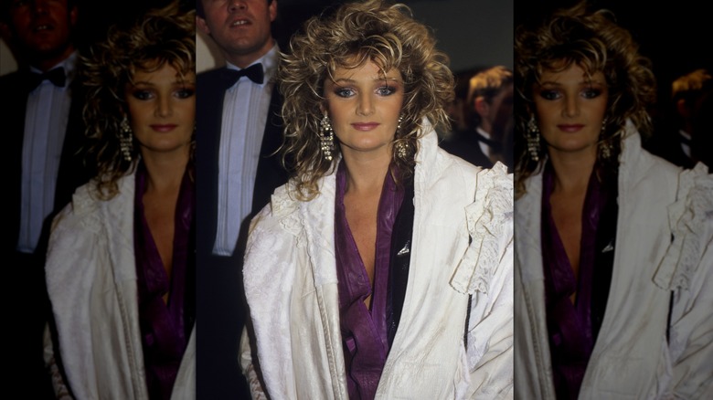 Bonnie Tyler photographed in a white coat at the British Record Industry Awards in 1986