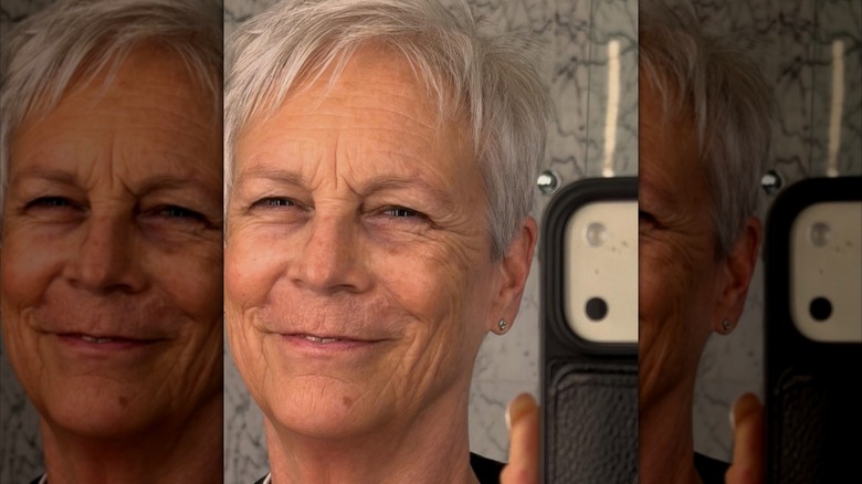 Jamie Lee Curtis smiling in a mirror selfie.