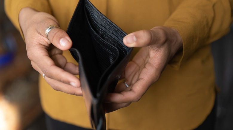 woman with empty wallet