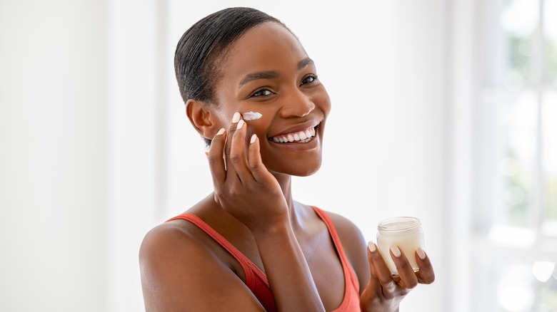 woman applying face cream