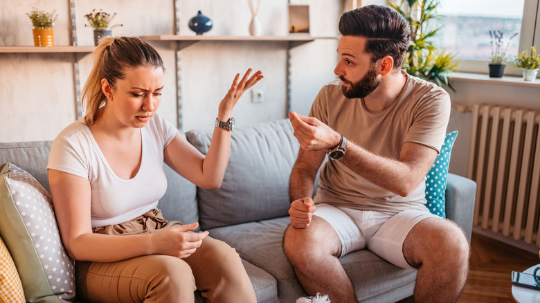 couple on a couch arguing