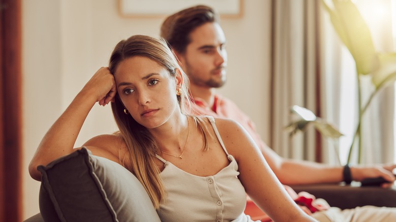worried girl sitting with boyfriend