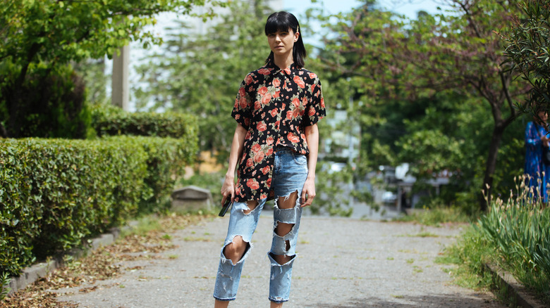 woman with half-tucked shirt