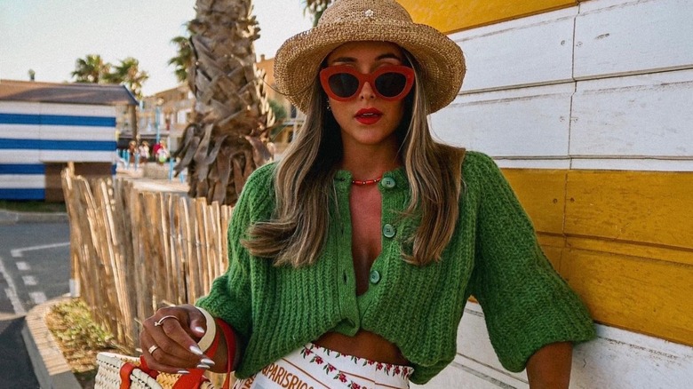 woman with sweater tucked in bra