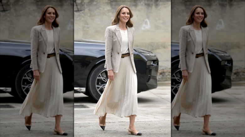 Kate Middleton wearing a striped blazer and white skirt