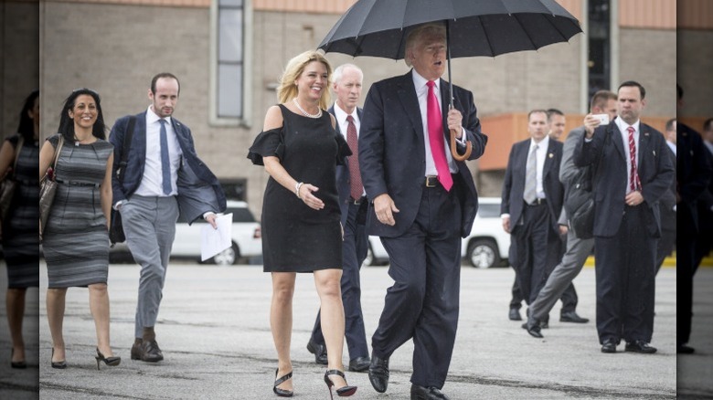 Pam Bondi walks with Donald Trump in 2016