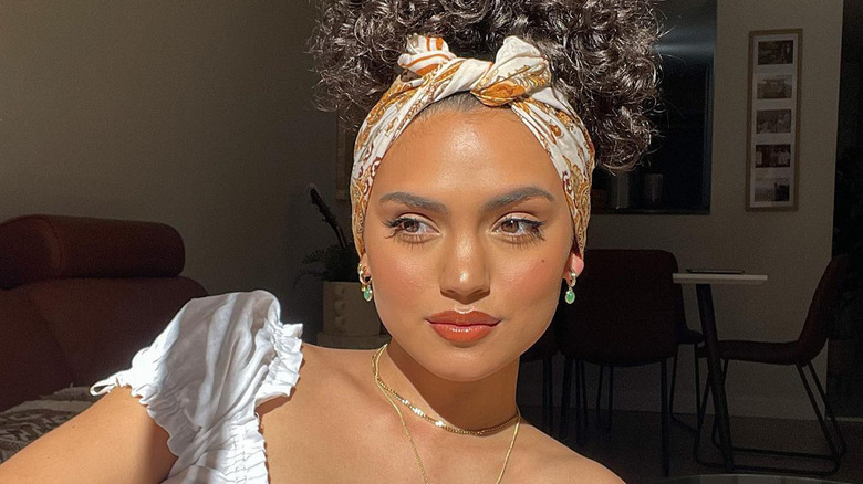 Soft peach makeup curly hair